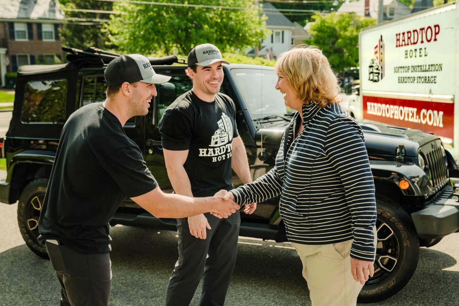 Ryan and Cole were greeting a satisfied customer after SoftTop installation at North Chelmsford